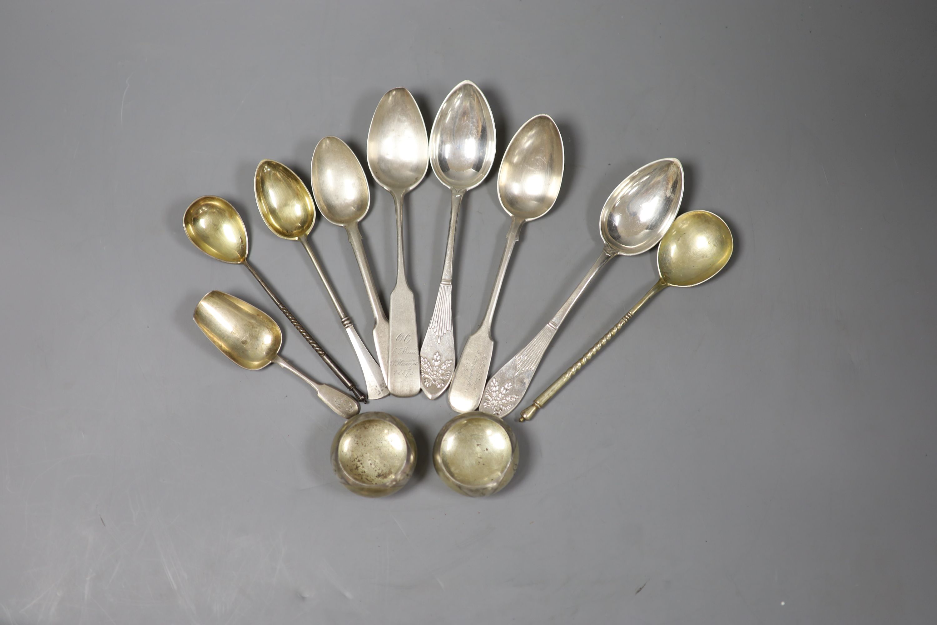 Nine assorted 19th century and later Russian 84 zolotnik spoons and a similar pair of salts